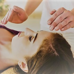 woman receiving reiki healing purple shirt